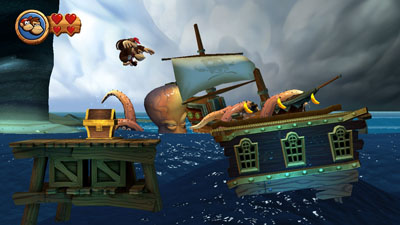 Im Hintergrund des Levels von Donkey Kong Country Returns HD zerschlägt eine Krake eine Piratenschiff